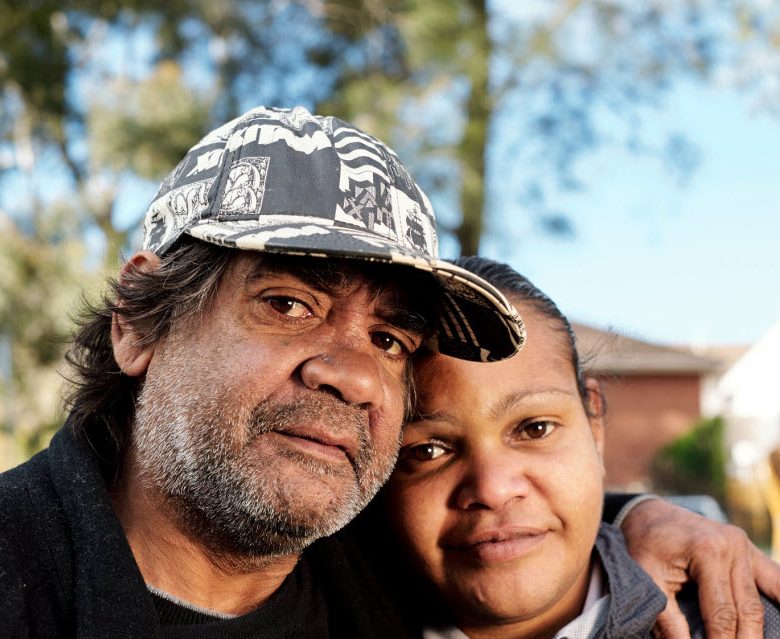 Father and daughter looking at the camera